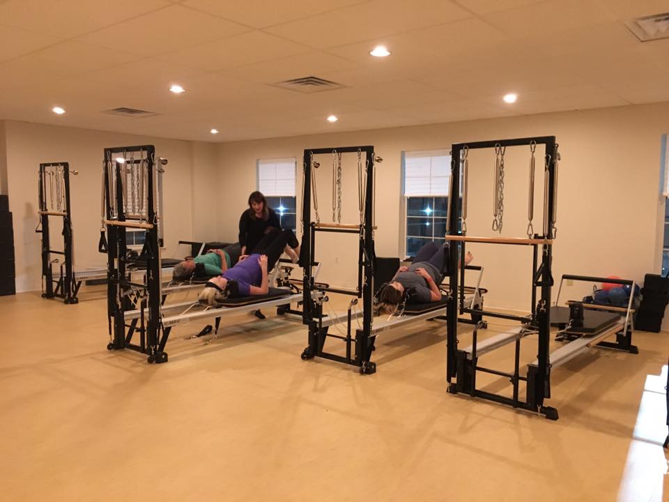 Some of our runners try out a pilates reformer class.