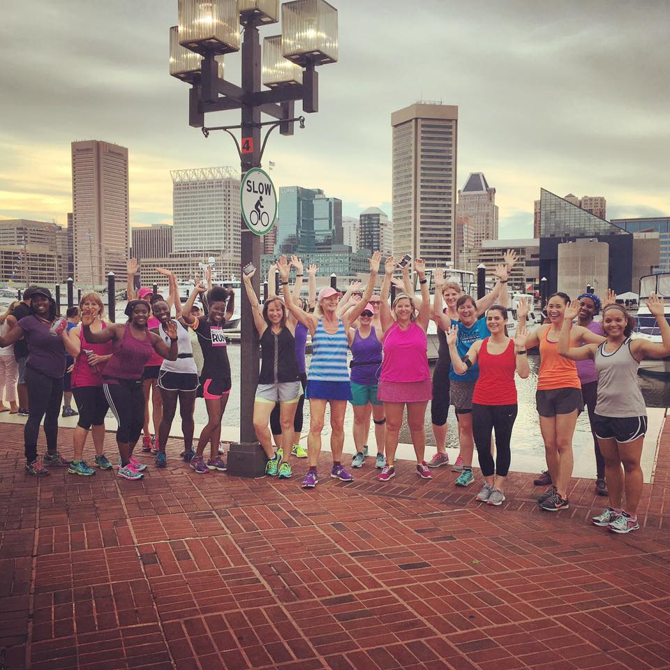 A group training for the Baltimore Women's Classic meets for a run around the Inner Harbor.