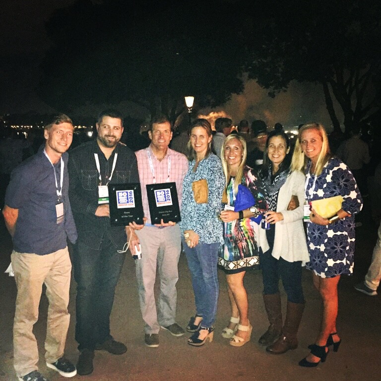 The team celebrates after being named 2016 Running Store of the Year at The Running Event in Orlando.