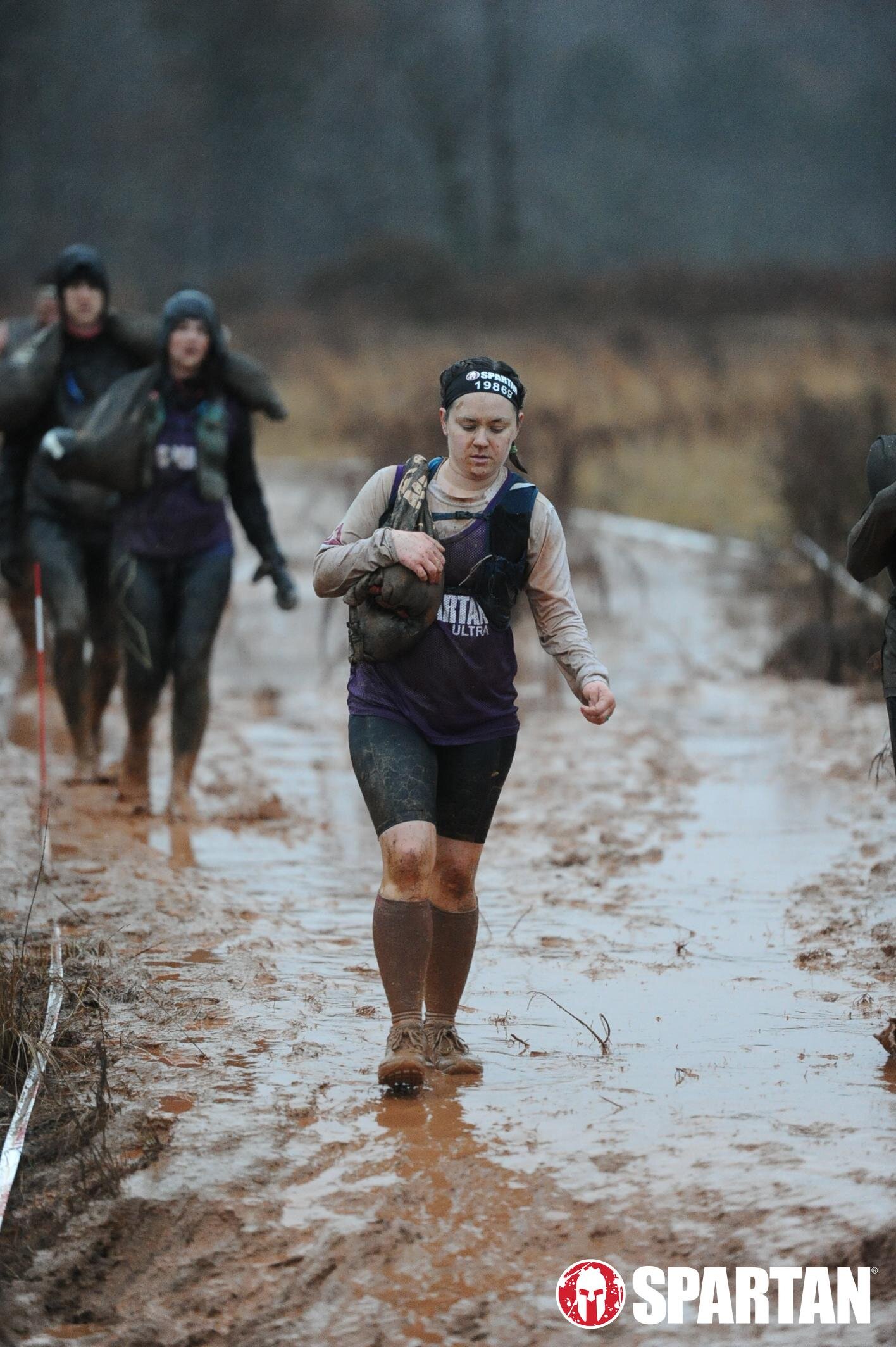 Trekking through mud during the Spartan Ultra marathon.